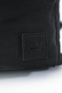 Close up of small crown logo in bottom corner