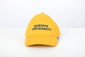 Yellow baseball cap with Queen's University embroidered on the front in Navy