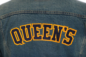Close up embroidery of "Queen's" on the back of our jean jacket