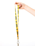 Load image into Gallery viewer, yellow lanyard with queens university logos in navy
