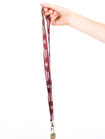 Load image into Gallery viewer, burgundy lanyard with queens university logos in white
