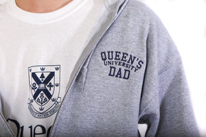 Close up of grey zip up hoodie with Queen's Dad embroidered on the chest