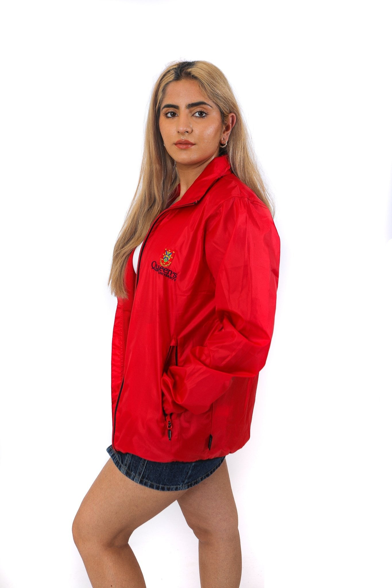 Side of red zip up rain jacket with red Queen's crest logo