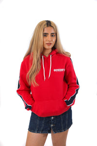 Red hoodie with blue arm stripes and a white queen's logo
