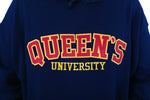 Load image into Gallery viewer, Close up of red Queen&#39;s logo on blue sweater
